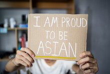 A Man Holding I Am Proud To Be Asian Sign