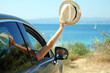 © Kostia - happy people driver on car near sea