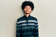 © Krakenimages.com - Young african american man with afro hair wearing casual clothes relaxed with serious expression on face. simple and natural looking at the camera.