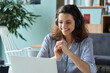 © insta_photos - Happy latin hispanic girl college student wearing headphones watching distance online class, remote university webinar or having talk on laptop video conference call virtual meeting at home or campus.