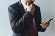 Distressed entrepreneur using mobile smart phone, reading an e-mail or text message