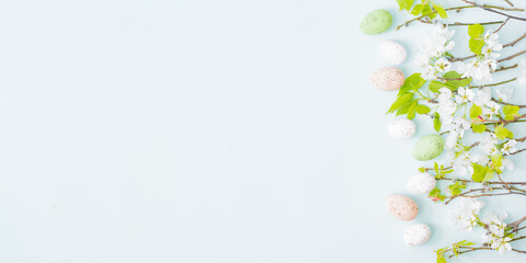 Wall Mural - flat lay easter composition with spring flowers and easter eggs on a light background