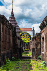 Wall Mural - Vertical shot of the Prasat Wat Sa Kamphaeng Yai Thai Temple in Sisaket, Thailand