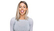 © Krakenimages.com - Beautiful blonde woman wearing casual clothes sticking tongue out happy with funny expression. emotion concept.