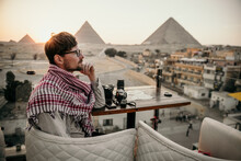 Young Man Overlooking The Pyramids Of Giza