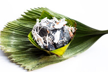 Black Coconut Sweet Pudding With Coconut Topping In Banana Leaf On Fiji Fan Palm Leaf