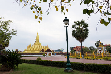 Wall Mural - Pha That Luang Vientiane, Laos. That-Luang Golden Pagoda in Vientiane, Laos. Pha That Luang at Vientiane. Blue sky background beautiful.