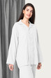 Woman in white pajamas nightwear studio shoot