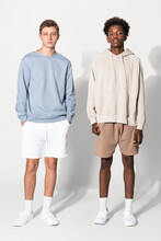 Teenage Boys In Blue Sweater And Beige For Streetwear Apparel Shoot