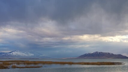 Wall Mural - Rain storm rolling over Utah Lake in time lapse looking towards Mt. Nebo and West Mountain.