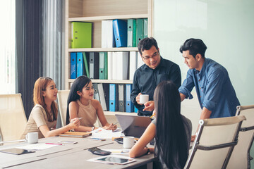 Wall Mural - Happiness diversity business team meeting corporate office desk in company meeting room. Asian team group partner brainstorming discussion multiethnic people sitting share ideas teamwork in boardroom