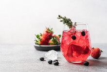 Pink Drink With Crushed Ice And Thyme. Strawberry And Blueberry Lemonade. Summer Refreshing Drink