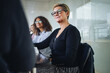 © Jacob Lund - Senior businesswoman in meeting at office