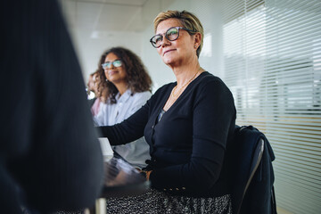 Senior businesswoman in meeting at office