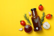 Barbecue sauce and ingredients on yellow background