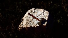 War Ax For Viking On The Rock At Sunset