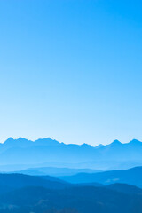 blue surreal mountains against the backdrop of a cyan sky, fantastic fairytale mountain landscape