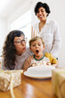 © (JLco) Julia Amaral - Lesbian parents with boy kid celebrating birthday