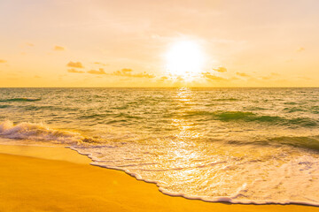 Wall Mural - Beautiful tropical beach sea ocean at sunset or sunrise time