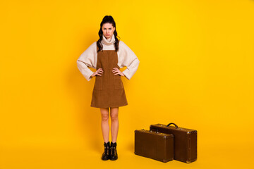 Poster - Full length photo of sweet upset young woman wear brown dress baggage flight delay isolated yellow color background