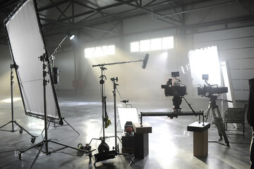 profesional video studio.behind-the-scenes of a video shooting.behind the shooting production silhou