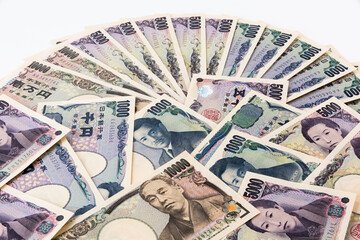 Wall Mural - Japanese banknotes isolated on white background