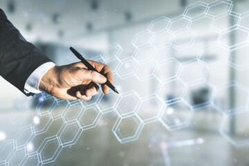 Aufkleber - Male hand with pen draws abstract virtual technology sketch with hexagon grid on blurred office background, future technology and AI concept. Double exposure