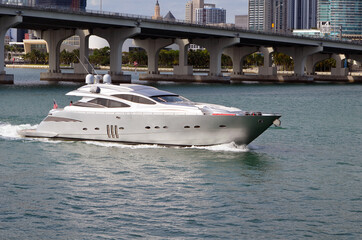 Silver motor yacht on Biscayne Bay off of downtown Miami,Florida