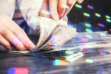 Double exposure of technology drawing hologram and us dollars bills and man hands. Data concept