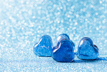 Glass Blue Hearts On A Blue Background. Concepts Of Valentines Day Card, Wedding And Invitation.