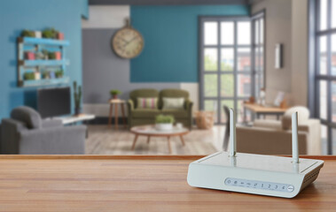 Modem and router box on the table and living room background blur concept.