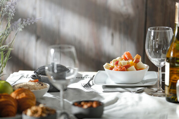 Poster - Spring breakfast on a wooden table in a mountain hut in the morning 