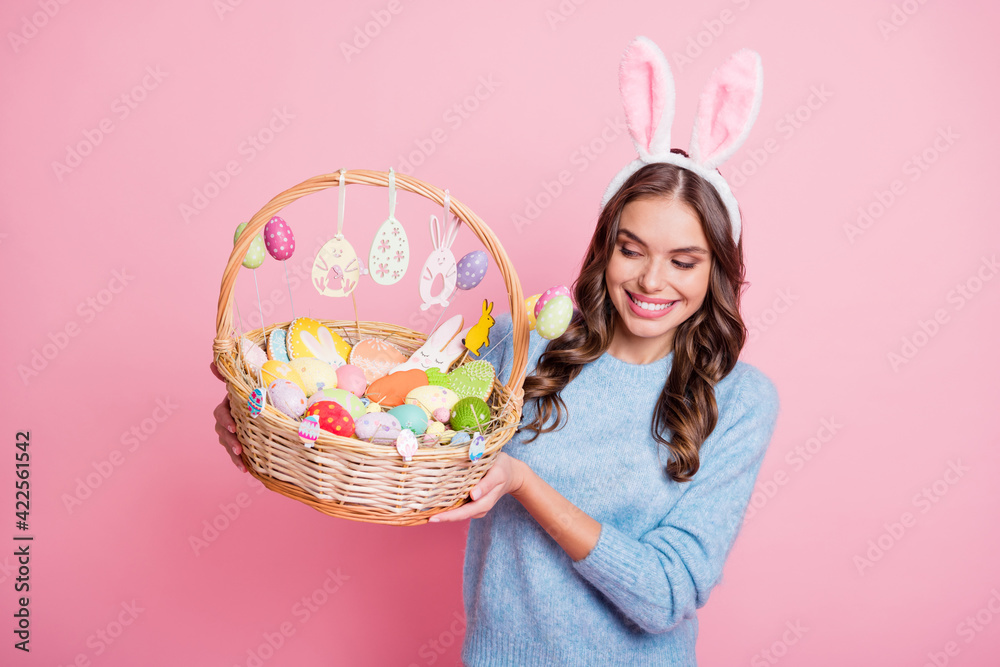 Photo of lady presenting look easter basket toothy smile wear hare ears headband blue pullover isolated pink background - obrazy, fototapety, plakaty 