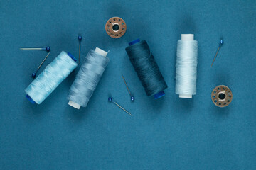 sewing needles with tools top view, blue color monochrome
