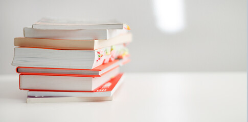 Wall Mural - Colored books on a white background with a place for an inscription. Composition of books for reading. self-development books.