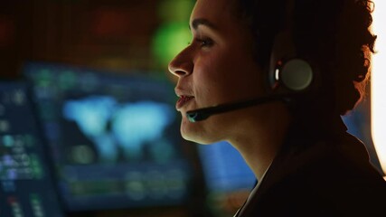 Aufkleber - Close Up Portrait of Multiethnic Female IT Technical Support Specialist Talking with a Client in Headphones and Working on Desktop Computer in Monitoring Control Room with Big Digital Screens.