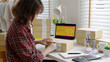 © ChayTee - Young attractive beautiful hipster asia female packing product small business parcel order online retail store for delivery to customer. SME owner work preparing dropshipping box at home office.
