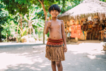 Young Indian From The Pataxo Tribe Of Southern Bahia. Indian Child Smiling And Looking At The Camera. Focus On The Face