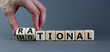 Rational or emotional symbol. Psychologist turns wooden cubes and changed the word 'rational' to 'emotional'. Beautiful grey background. Psychological and rational or emotional concept. Copy space.