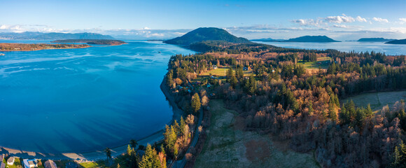 Aerial View of Lummi Island, Washington. Springtime warm evening light on the south end of Lummi island located in the Salish Sea area of the Pacific Northwest near Bellingham, Washington.