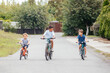 © oksix - Kids have a leisure on bicycles outoodrs