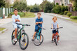 © oksix - Kids have a leisure on bicycles outoodrs