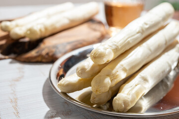 Wall Mural - New harvest of high quality Dutch white asparagus washed, uncooked, tasty vegetarian dinner