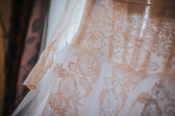 Poster - Closeup shot of a piece of embroidered bridal dress with shiny golden details