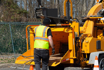 wood chipper machine releasing the shredded woods