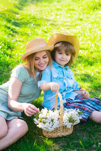 Happy Mother Day With Son At Picnic. Family Mom With Kid Sitting On The Grass In Park.