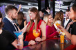 © JackF - Attractive girl flirting with handsome man on cocktail party in a bar