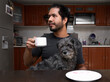 © Narayan - man drinking coffee with his dog, pet concept