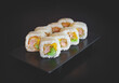 Sushi roll with salmon tempura, lettuce and rice paper