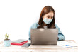 © tai - A serious Asian office woman working on a laptop is wearing a face mask against coronavirus, Covid19, Sars infection while working on a laptop computer in the office. New normal office concept